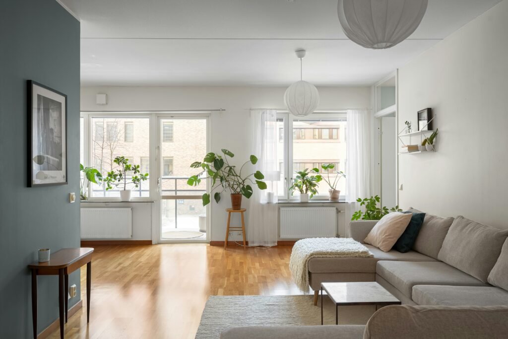a living room filled with furniture and lots windows