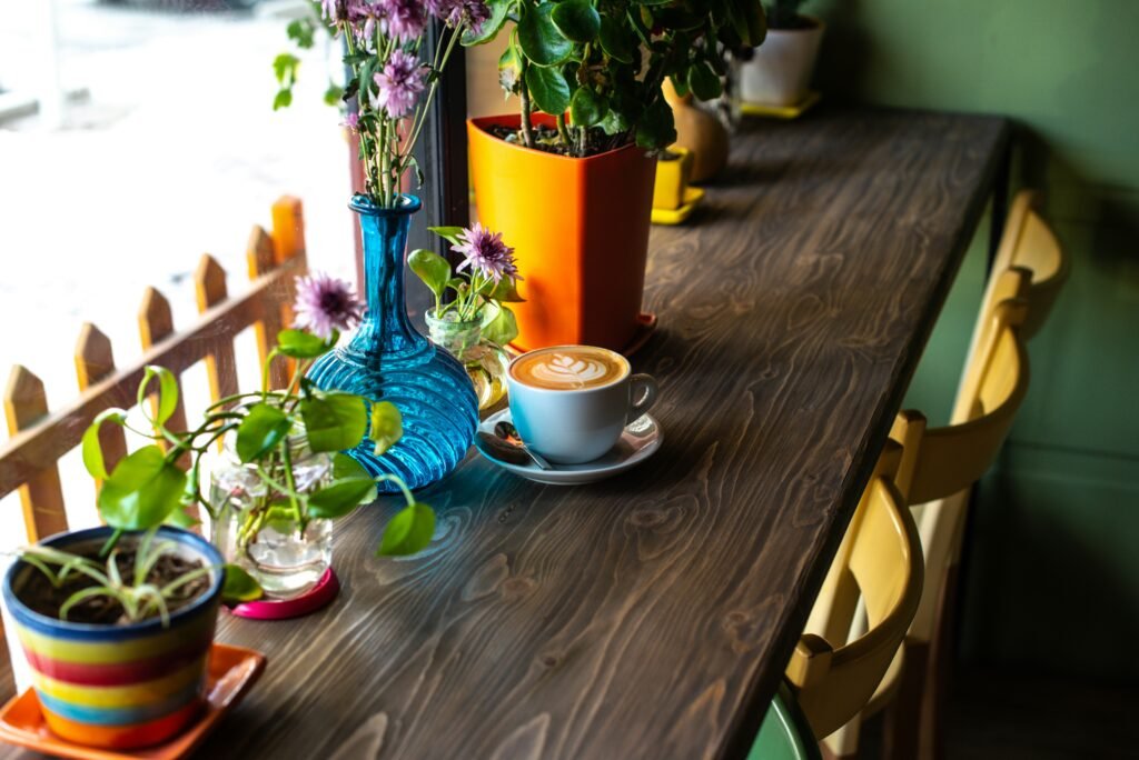 a coffee this plate and green plant this table Beautiful Coffee Table Styling Tips