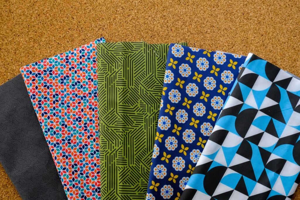 a group of cloths sitting on top a floor Color Scheme