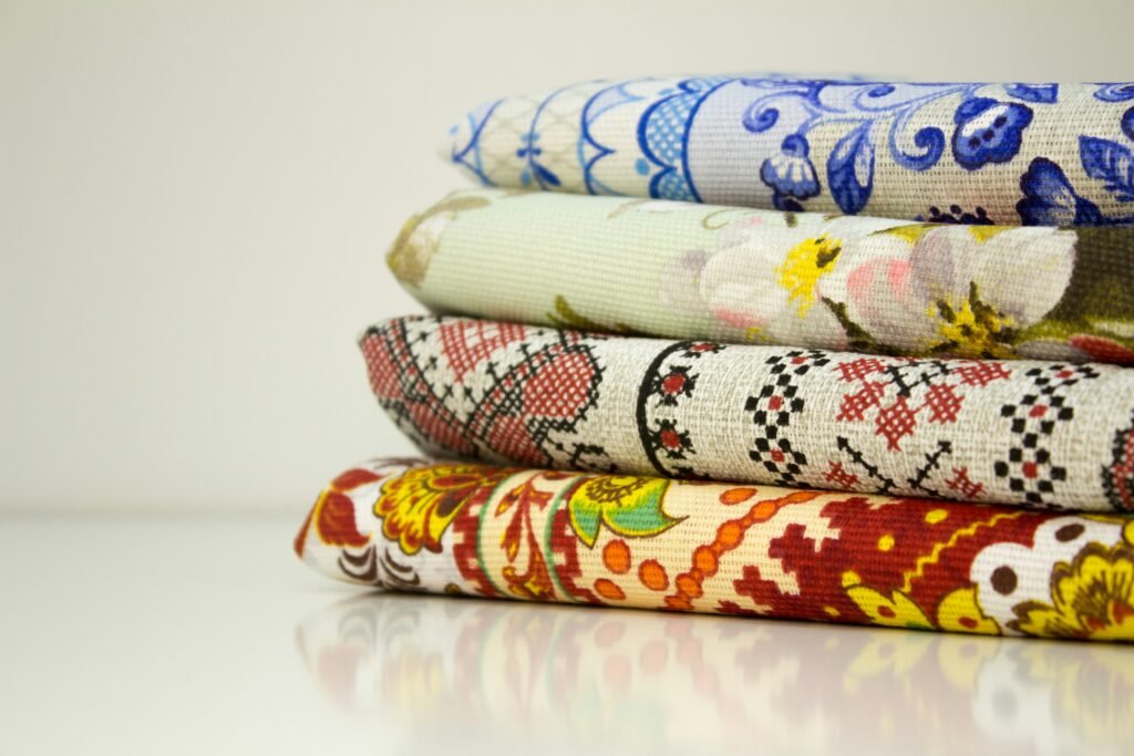 a stack of different colored fabrics sitting on top of each other Color Scheme