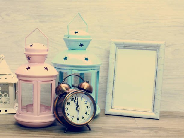 lamp and watch with fram on wallpaper